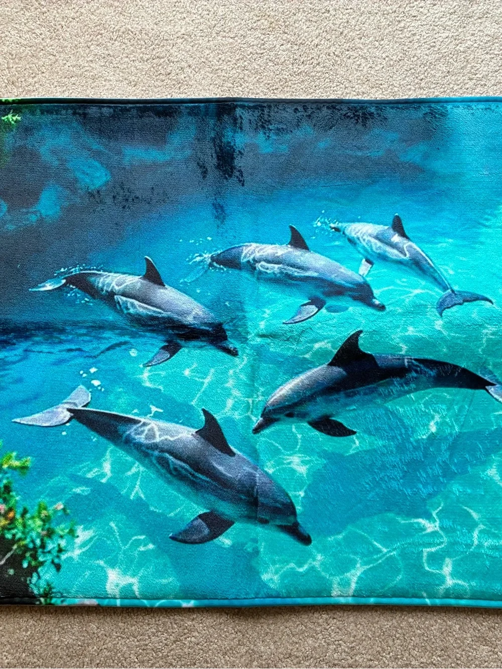 Ocean themed, dolphin pattered, bath mat.